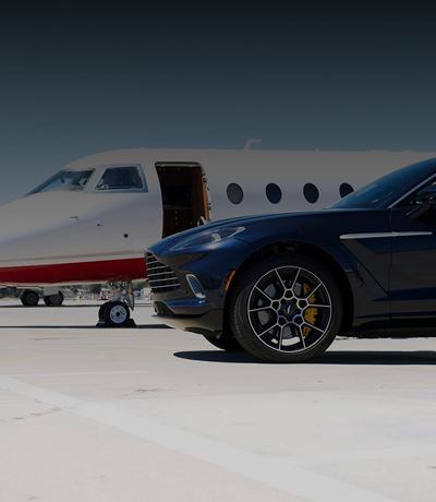 Amalfi Jets charter aircraft gulfstream g200 on the tarmac with a black Aston Martin beside it.