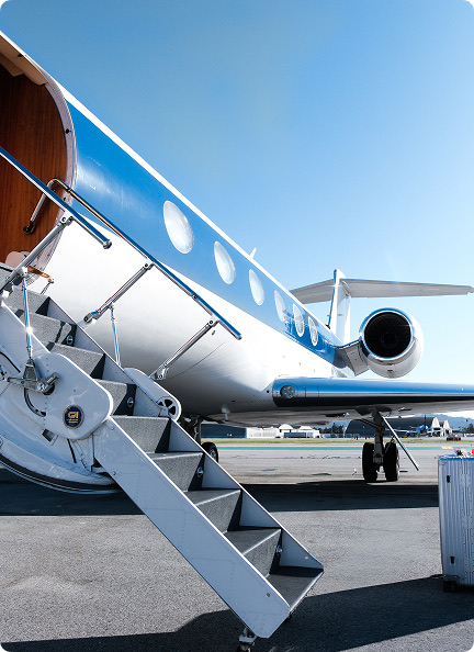 Amalfi Jets Gulfstream private jet with blue stripe parked on tarmac with boarding stairs extended.