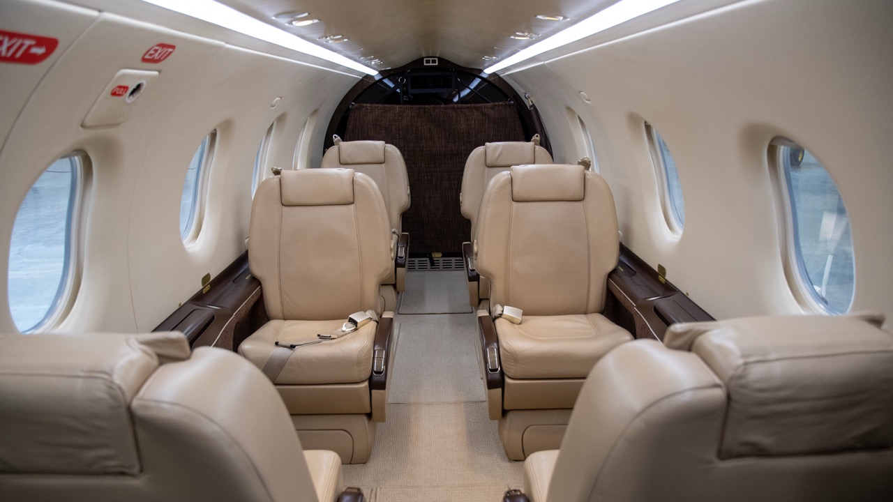 Luxury bright leather interior of a modern commercial airplane. Small business turboprop aircraft. Pilatus PC12