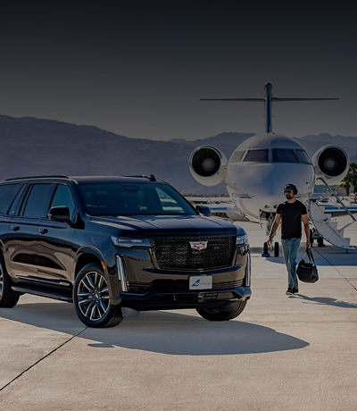 Male traveler walking towards Black Car Service at the tarmac with Amalfi Aircraft in the background.
